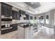 Spacious kitchen with island, stainless steel appliances, and white subway tile backsplash at 5020 W Dickens Ave, Tampa, FL 33629