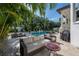 Outdoor patio with seating and mosaic table at 5020 W Dickens Ave, Tampa, FL 33629