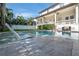 Relaxing pool with built-in seating and a view of the home at 5020 W Dickens Ave, Tampa, FL 33629