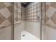 Large walk-in shower with diamond patterned tile at 5020 W Dickens Ave, Tampa, FL 33629