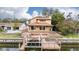 Aerial view of house with large deck, dock, and boat lift at 513 Suwanee Cir, Tampa, FL 33606