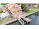 Aerial view of house with large deck and dock at 513 Suwanee Cir, Tampa, FL 33606