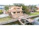 Aerial view of house with large deck and dock at 513 Suwanee Cir, Tampa, FL 33606