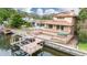 Aerial view of house with large deck, dock, and boat lift at 513 Suwanee Cir, Tampa, FL 33606