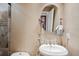 Bathroom features a pedestal sink and an oval mirror at 513 Suwanee Cir, Tampa, FL 33606