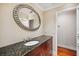 Stylish bathroom features dark wood cabinets and granite countertop at 513 Suwanee Cir, Tampa, FL 33606