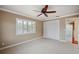 Bedroom with ceiling fan, window shutters, and closet at 513 Suwanee Cir, Tampa, FL 33606