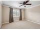 Well-lit bedroom featuring neutral walls, carpet, and window treatments at 513 Suwanee Cir, Tampa, FL 33606