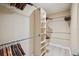 Large walk-in closet with hanging rods and shelving at 513 Suwanee Cir, Tampa, FL 33606