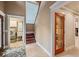 Elegant entry hall with laundry, wine storage, and staircase at 513 Suwanee Cir, Tampa, FL 33606