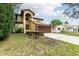 Two-story house with a brown garage door and nicely landscaped front yard at 513 Suwanee Cir, Tampa, FL 33606