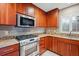 Kitchen with granite countertops and stainless steel appliances at 513 Suwanee Cir, Tampa, FL 33606