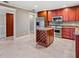 Kitchen with island, granite counters, and stainless steel appliances at 513 Suwanee Cir, Tampa, FL 33606