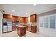 Kitchen with island, granite counters, and stainless steel appliances at 513 Suwanee Cir, Tampa, FL 33606