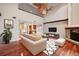 Living room with hardwood floors and stylish furniture arrangement at 513 Suwanee Cir, Tampa, FL 33606