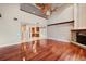 Bright living room featuring hardwood floors and a high ceiling with fan at 513 Suwanee Cir, Tampa, FL 33606