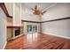 Living room with hardwood floors, fireplace, and sliding glass doors at 513 Suwanee Cir, Tampa, FL 33606