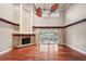 Living room with hardwood floors, fireplace and sliding doors to patio at 513 Suwanee Cir, Tampa, FL 33606