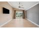 Main bedroom with light flooring and sliding doors to patio at 513 Suwanee Cir, Tampa, FL 33606