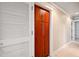 Walk-in pantry with wood shelving and white louvered doors at 513 Suwanee Cir, Tampa, FL 33606