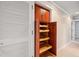 Well-organized pantry with wood pull-out shelves at 513 Suwanee Cir, Tampa, FL 33606