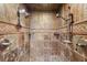 Large walk-in shower with dual shower heads and stone tile at 513 Suwanee Cir, Tampa, FL 33606