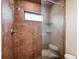 Large walk-in shower with glass enclosure and brown tile at 513 Suwanee Cir, Tampa, FL 33606