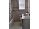 Updated bathroom with white vanity and tiled floors at 5130 Dr Martin Luther King Jr St S, St Petersburg, FL 33705