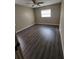 Simple bedroom with dark wood-look floors at 5130 Dr Martin Luther King Jr St S, St Petersburg, FL 33705