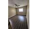 Bedroom with dark laminate flooring and ceiling fan at 5130 Dr Martin Luther King Jr St S, St Petersburg, FL 33705