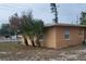 Rear view of house showing tan exterior and yard at 5130 Dr Martin Luther King Jr St S, St Petersburg, FL 33705