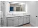 Modern bathroom with double vanity and LED mirror at 528 Rose Apple Cir, Port Charlotte, FL 33954