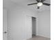 Bedroom with ceiling fan and sliding door closet at 528 Rose Apple Cir, Port Charlotte, FL 33954