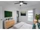 Light-filled bedroom, featuring a dresser and a closet at 528 Rose Apple Cir, Port Charlotte, FL 33954