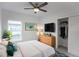 Spacious bedroom with a dresser, closet and large window at 528 Rose Apple Cir, Port Charlotte, FL 33954