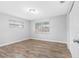 Bright bedroom with wood-look floors and large windows at 5712 17Th N Ave, St Petersburg, FL 33710