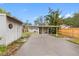 Covered carport with storage shed and fenced yard at 5712 17Th N Ave, St Petersburg, FL 33710