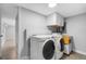 Convenient laundry room with washer, dryer, and cabinets at 5712 17Th N Ave, St Petersburg, FL 33710