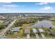 Aerial view showing a house community and a lake at 5720 107Th E Ter, Parrish, FL 34219