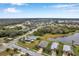 Aerial view of a residential neighborhood near a lake at 5720 107Th E Ter, Parrish, FL 34219