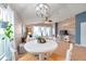 Bright dining area with a round table and chairs near the kitchen at 5720 107Th E Ter, Parrish, FL 34219