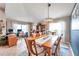 Dining room with wooden table, chandelier, and home office at 5720 107Th E Ter, Parrish, FL 34219