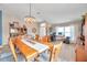 Bright dining room featuring a wooden table and chandelier at 5720 107Th E Ter, Parrish, FL 34219