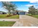 House exterior, driveway, and sidewalk with street view at 5720 107Th E Ter, Parrish, FL 34219