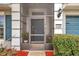 Front entrance with screened porch and blue door at 5720 107Th E Ter, Parrish, FL 34219