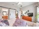 Main bedroom features a king bed and sliding barn door at 5720 107Th E Ter, Parrish, FL 34219