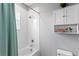 Simple bathroom with a tub shower combo and storage at 6205 Voyagers Pl, Apollo Beach, FL 33572