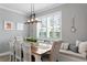 Bright dining area with farmhouse table and bench seating at 6205 Voyagers Pl, Apollo Beach, FL 33572