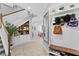 Bright entryway with built-in shelving and staircase at 6205 Voyagers Pl, Apollo Beach, FL 33572