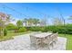 Backyard patio with string lights and dining table at 6205 Voyagers Pl, Apollo Beach, FL 33572